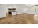 Open-concept living area with a breakfast bar and a view of the kitchen at 1409 Gatlin Pl, The Villages, FL 32163
