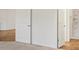 An ensuite bathroom adjacent to the bedroom with carpet and a shower at 1409 Gatlin Pl, The Villages, FL 32163