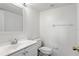 Bright white bathroom features a modern vanity and neutral finishes at 1413 Silverthorn Dr, Orlando, FL 32825