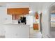 Open kitchen featuring wood cabinets, black appliances, and a breakfast bar area at 1413 Silverthorn Dr, Orlando, FL 32825