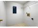 The laundry room includes a utility sink and shelving unit at 1413 Silverthorn Dr, Orlando, FL 32825