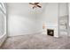 Bright living room with a fireplace, neutral carpet, high ceilings, and plenty of natural light at 1413 Silverthorn Dr, Orlando, FL 32825