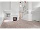 Spacious living room featuring a fireplace, staircase, neutral carpet, and lots of natural light at 1413 Silverthorn Dr, Orlando, FL 32825