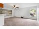 Cozy living room with neutral carpet and multiple windows providing ample natural light at 1413 Silverthorn Dr, Orlando, FL 32825