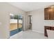 Bright breakfast nook with sliding glass doors and white tile flooring at 15287 Aquarius Way, Mascotte, FL 34753
