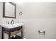 This bathroom features a white sink and black hardware at 155 W C-466, Lot # 1 W C 466, Oxford, FL 34484