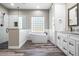 Modern bathroom featuring a glass shower, soaking tub, granite vanity, and shaker cabinets at 155 W C-466, Lot # 1 W C 466, Oxford, FL 34484