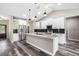 Bright open kitchen with stainless steel appliances, granite countertops, and an island at 155 W C-466, Lot # 1 W C 466, Oxford, FL 34484