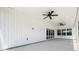 This is a covered patio with white walls and ceiling fans at 155 W C-466, Lot # 1 W C 466, Oxford, FL 34484