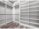 Spacious walk-in closet with custom shelving and bars, perfect for maximizing storage at 155 W C-466, Lot # 1 W C 466, Oxford, FL 34484