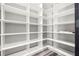 Spacious walk-in closet with custom shelving and modern design, great for organization at 155 W C-466, Lot # 1 W C 466, Oxford, FL 34484