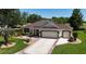 Charming home with landscaped yard and a spacious three-car garage at 17194 Se 85Th Willowick Cir, The Villages, FL 32162