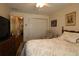 Comfortable bedroom featuring a ceiling fan, closet, neutral walls, and light patterned bedding at 17194 Se 85Th Willowick Cir, The Villages, FL 32162