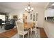 Comfortable dining area open to the living room and the kitchen at 17194 Se 85Th Willowick Cir, The Villages, FL 32162
