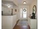 Bright foyer with natural light and view of the kitchen at 17194 Se 85Th Willowick Cir, The Villages, FL 32162