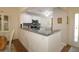 Eat-in kitchen with granite countertops and stainless steel appliances at 17194 Se 85Th Willowick Cir, The Villages, FL 32162