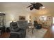 Comfortable living area with kitchen view and modern furniture at 17194 Se 85Th Willowick Cir, The Villages, FL 32162