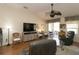 Cozy living space with a large television, modern furniture, and a view to the lanai at 17194 Se 85Th Willowick Cir, The Villages, FL 32162