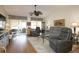 Comfortable living area with vaulted ceiling, ceiling fan and lots of natural light at 17194 Se 85Th Willowick Cir, The Villages, FL 32162