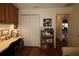 Home office with built-in shelving, cabinets, and a closet visible at 17194 Se 85Th Willowick Cir, The Villages, FL 32162