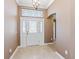 Welcoming foyer with tile flooring, decorative chandelier, and views into the home at 17427 Se 72Nd Overbrook Ct, The Villages, FL 32162