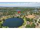 An aerial view showing the location of the single Gathering home surrounded by lakes and greenery at 1761 Country Terrace Ln, Apopka, FL 32703