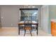 Bright dining area with a wooden table set under modern lighting, perfect for Gathering meals and entertaining at 1761 Country Terrace Ln, Apopka, FL 32703