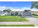 Charming single Gathering home with manicured lawn, mature landscaping, and two car garage at 1761 Country Terrace Ln, Apopka, FL 32703