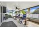Enjoy the screened lanai featuring a ceiling fan, tile flooring, and outdoor seating at 1761 Country Terrace Ln, Apopka, FL 32703