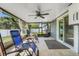 Relax in the screened lanai with tile flooring, ceiling fan, and access to the backyard at 1761 Country Terrace Ln, Apopka, FL 32703