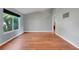 Bright living room featuring laminate flooring, neutral wall paint, a large window and vaulted ceilings at 1761 Country Terrace Ln, Apopka, FL 32703