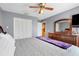 Comfortable bedroom with ample closet space, ceiling fan, and relaxing ambiance for restful nights at 1761 Country Terrace Ln, Apopka, FL 32703