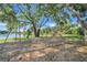 Community playground with swings and play structure near a peaceful lake at 1761 Country Terrace Ln, Apopka, FL 32703
