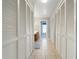 Large walk in closet with multiple rows of white bi-fold doors and tile flooring at 1761 Country Terrace Ln, Apopka, FL 32703