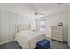 Bright bedroom with ceiling fan, light-colored decor, and tiled floors at 17800 Se 91St Gaylark Ave, The Villages, FL 32162