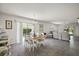 Open dining and living area with sliding door access to outdoor space at 17800 Se 91St Gaylark Ave, The Villages, FL 32162