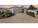 Charming one-story home with a well-maintained lawn and a two-car garage at 17800 Se 91St Gaylark Ave, The Villages, FL 32162