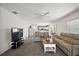 Open concept living room with neutral color palette and ceiling fan at 17800 Se 91St Gaylark Ave, The Villages, FL 32162
