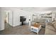 Open-concept living room with tile floors connecting the kitchen and bedrooms at 17800 Se 91St Gaylark Ave, The Villages, FL 32162