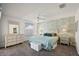 This main bedroom features large windows, floral wallpaper, and tiled floors at 17800 Se 91St Gaylark Ave, The Villages, FL 32162