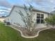 Clean home exterior showcasing a well-kept yard and landscaping for enhanced curb appeal at 1812 Sanibel Ct, The Villages, FL 32162