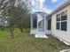 Enclosed porch addition for additional outdoor living space with easy access to the backyard at 1812 Sanibel Ct, The Villages, FL 32162