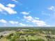 Expansive aerial view of the property, outlined in yellow, showcasing the land's lush greenery and natural beauty at 19621 Lake Lincoln Ln, Eustis, FL 32736