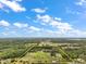 Breathtaking aerial perspective highlighting property boundaries, lush trees, and serene landscape at 19621 Lake Lincoln Ln, Eustis, FL 32736