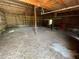 Expansive barn interior featuring exposed wooden beams, ample space, and a concrete floor, ready for personalization at 19621 Lake Lincoln Ln, Eustis, FL 32736