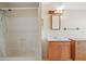 Simple bathroom with a shower-tub combo and a wood vanity, good natural light at 19621 Lake Lincoln Ln, Eustis, FL 32736