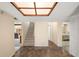 View of entryway with brick floors, stairway to the second floor, a bedroom, and a living room at 19621 Lake Lincoln Ln, Eustis, FL 32736