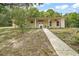 Ranch-style home with a columned front porch, featuring 