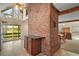 Open concept living space with brick fireplace and large windows with beautiful views at 19621 Lake Lincoln Ln, Eustis, FL 32736
