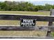 Rustic wooden fence displaying a 'Private Property' sign against a backdrop of lush greenery at 19621 Lake Lincoln Ln, Eustis, FL 32736